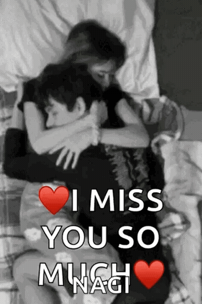 Black And White Man And Woman Hugging On Bed GIF