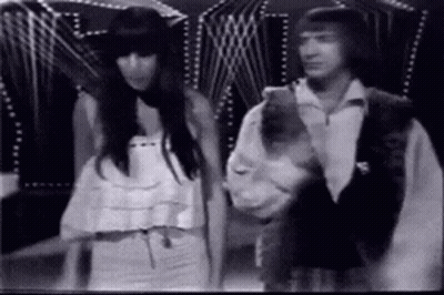 Black And White Man And Woman In Dark Room GIF