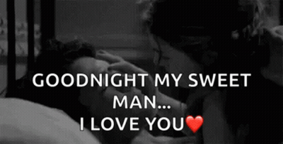 Black And White Man And Woman Kissing In Bed GIF