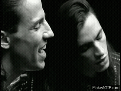 Black And White Man And Woman Singing GIF