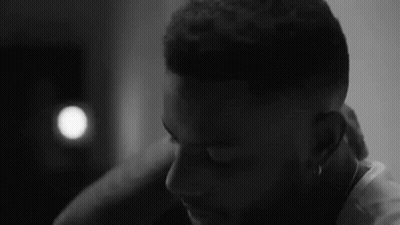 Black And White Man Eyes Closed Hand On Neck GIF