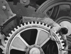 Black And White Man Fixing Gears GIF