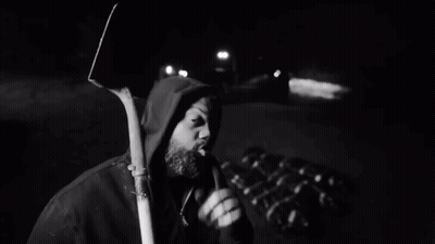 Black And White Man Holding Shovel GIF