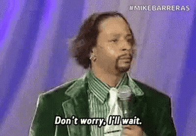 Black And White Man Holding Trophy In Room GIF