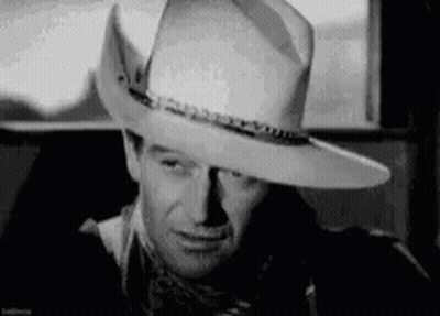 Black And White Man In Cowboy Hat And Scarf GIF