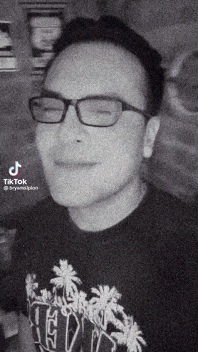Black And White Man In Glasses Wearing Ted Shirt GIF