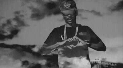 Black And White Man In Hat Making Heart Hands GIF