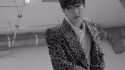 Black And White Man In Patterned Suit GIF
