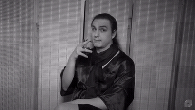 Black And White Man In Robe With Letter P GIF