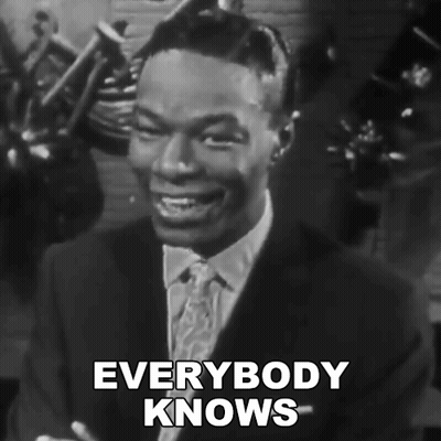 Black And White Man In Suit And Tie Saying Everybody Knows GIF