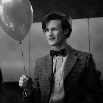 Black And White Man In Suit Holding Balloon GIF