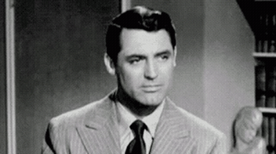 Black And White Man In Suit Making Funny Face GIF
