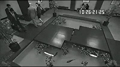 Black And White Man In Suit On Stage GIF