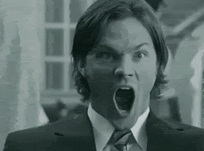 Black And White Man In Suit With Open Mouth GIF