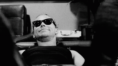 Black And White Man In Sunglasses Laying Down GIF