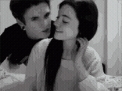 Black And White Man Kissing Woman On Forehead GIF