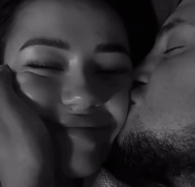 Black And White Man Kissing Woman's Forehead GIF