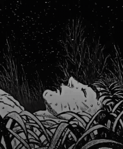 Black And White Man Laying Down In Grass GIF