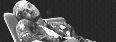 Black And White Man Lying In Chair GIF