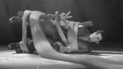 Black And White Man Lying On Floor With Hair Tied Up GIF