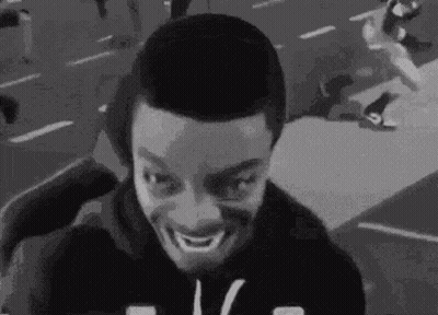 Black And White Man Making Funny Face On Street GIF