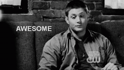 Black And White Man On Couch Saying Awesome GIF