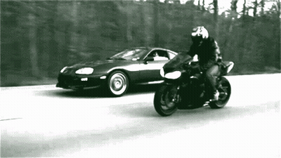 Black And White Man On Motorcycle And Car GIF