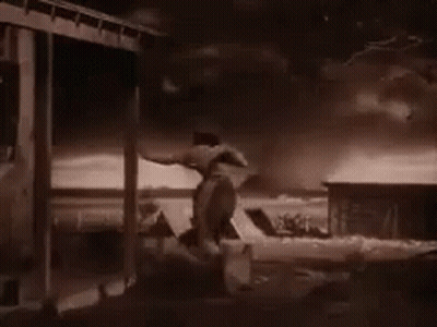 Black And White Man On Porch GIF