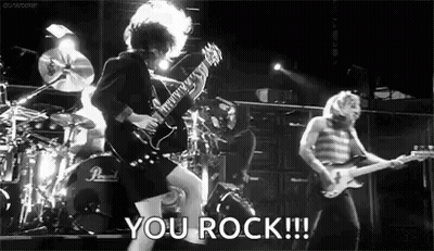Black And White Man Playing Guitar On Stage Saying You Rock GIF