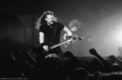 Black And White Man Playing Guitar On Stage GIF