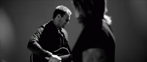 Black And White Man Playing Guitar Woman Watching GIF