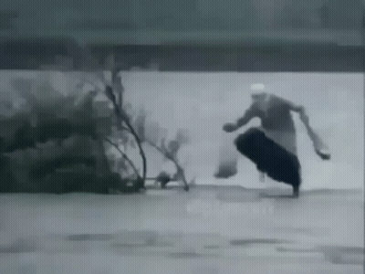 Black And White Man Running With Bag GIF