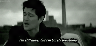 Black And White Man Singing I'm Still Alive But I'm Barely Breathing GIF