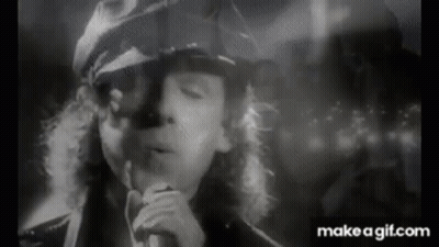 Black And White Man Singing Into Microphone Smoking GIF