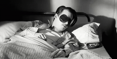 Black And White Man Sleeping In Bed With Blindfold GIF
