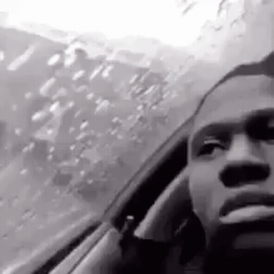 Black And White Man Smoking While Driving GIF