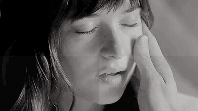 Black And White Man Touching Woman's Face With Finger GIF