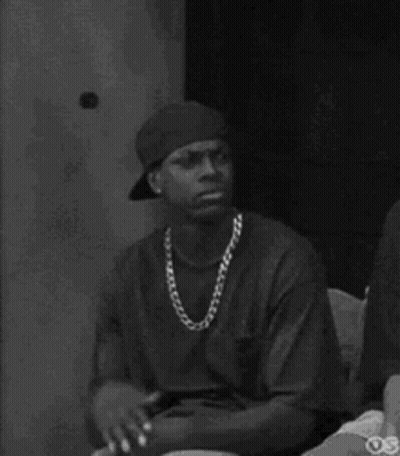Black And White Man With Baseball Cap And Chain GIF