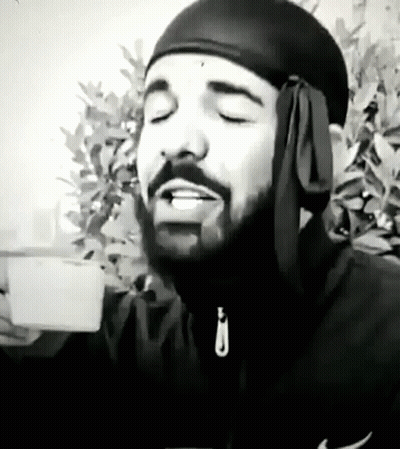Black And White Man With Beard And Headband Holding Coffee GIF