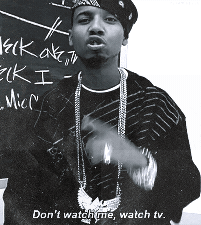 Black And White Man With Don't Watch Me Watch TV Sign GIF