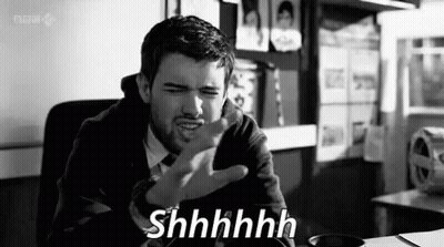 Black And White Man With Funny Face Saying Shhhh GIF