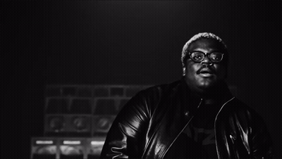 Black And White Man With Glasses Covering Face With Hands GIF