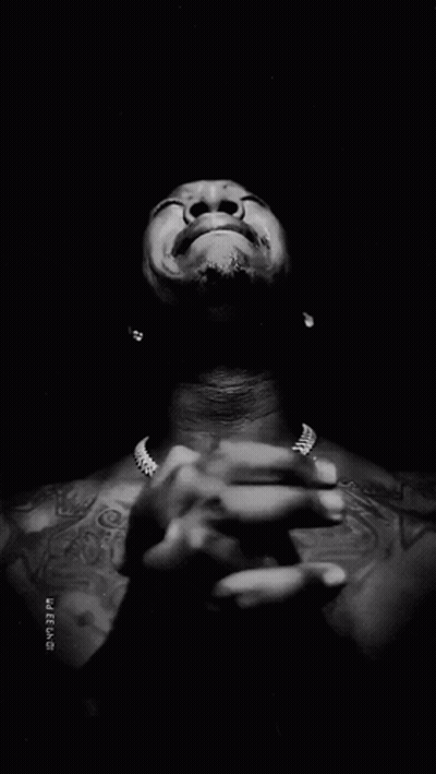 Black And White Man With Hands Folded In Front Of Face With Timestamp GIF