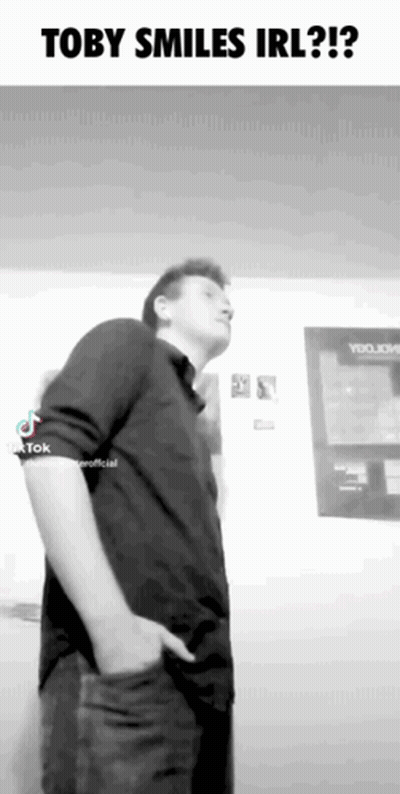 Black And White Man With Hands In Pockets Toby Smiles Irl GIF