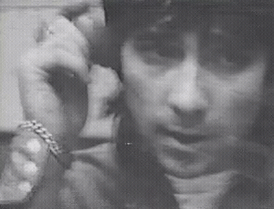 Black And White Man With Helmet On Phone GIF