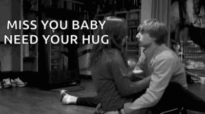 Black And White Man Woman Hugging On Floor GIF