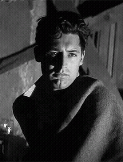 Black And White Man Wrapped In Blanket Smoking Cigarette GIF