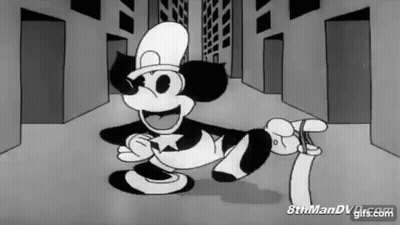 Black And White Mickey Mouse In Top Hat Holding Paper GIF