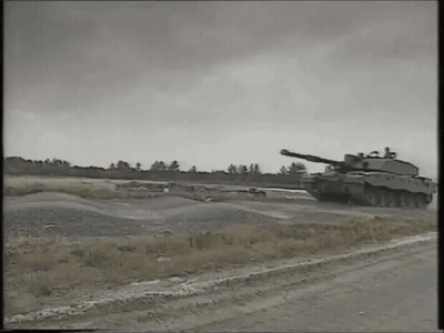 Black And White Military Tank Driving GIF
