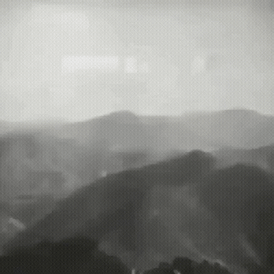 Black And White Mountain Range With Trees GIF
